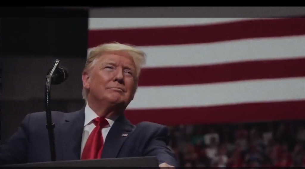 President Trump smiles at podium